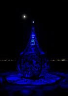 Blue night lights inside the Braindrop art sculpture