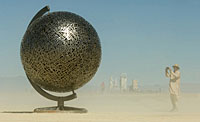 Stainless steel sphere representing planet earth art sculpture