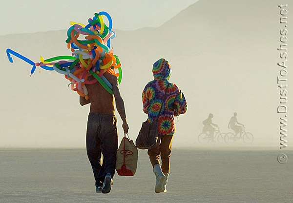Burning Man Couple with party balloons going home