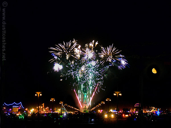 Burning Man fireworks and Moon main alley Night view from main alley of fireworks and Moon