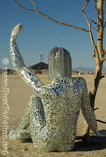 Mirror mosaic sculpture of woman