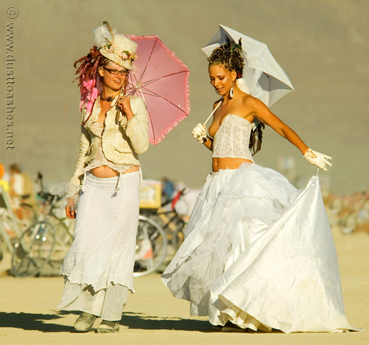 Burning Man women in white costumes 