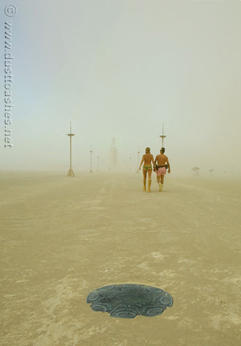 Burning Man Festival couple walking in the dust storm