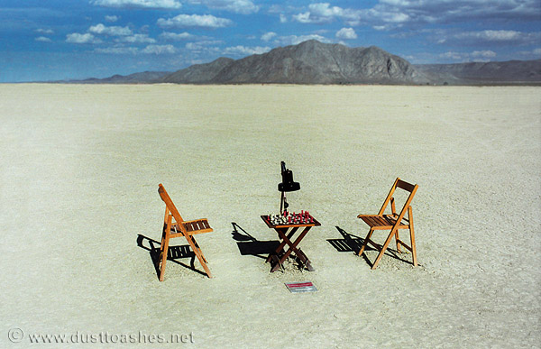 Surreal chess table in desert