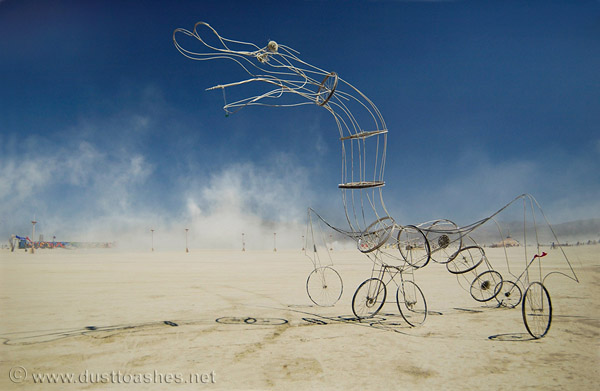 Sculpture of bird made out of bicycle wheels and wire rods
