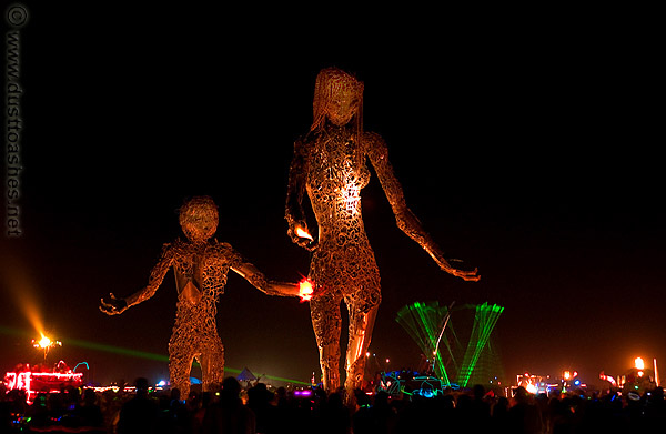 Saturday night view of Mother and Child art statues in desert