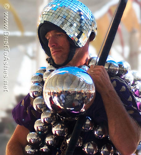 Burning Man costume made of metallic shiny balls