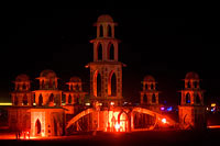 People lighting the temple with red light torches