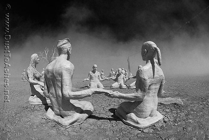 Plaster figures sitting in groups