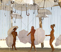 Girls Dancing with umbrellas at Burning Man festival