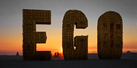 Giant golden letters representing our ego
