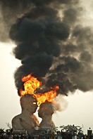 Smoke coming out of the heads of burning human figures