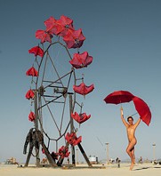 Woman dancing with umbrellas