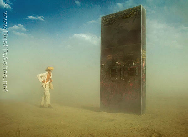 Burning Man 2009 Monolith-2.0 Arthur C. Clark Space Odyssey in Dust Storm Deep Playa Desert man fighting the dust storm
