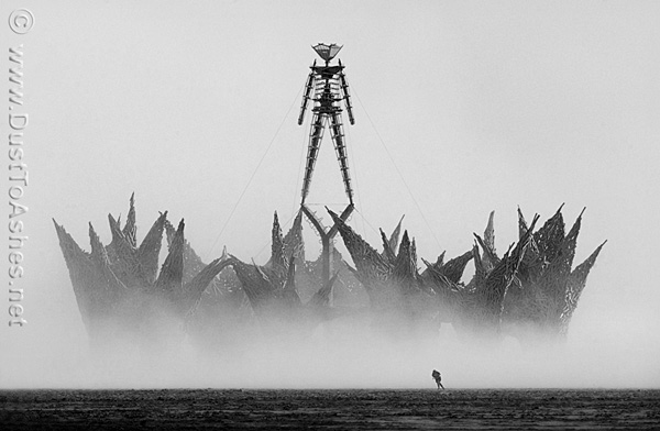black and whit photo of burning man in duststorm