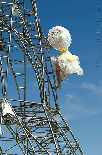 Burning Man Girl Climbing Elevation Tower by Michael Christian Umbrella Girls Climbing Elevation tower