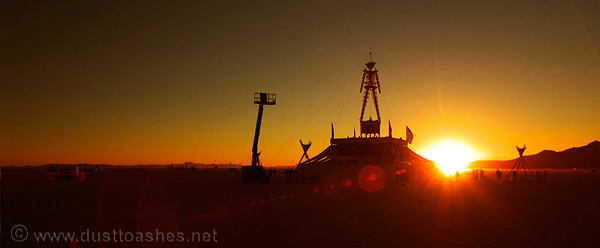 Early morning finnishing the burning man with cherry lift boom construction of Burning man