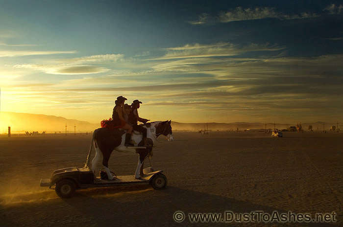 Family horseback riding sunset